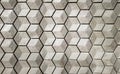 vitrified tiles in a hexagonal geometrical pattern with grey and white texture