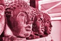 Viva Magenta monochrome color palette. Closeup statue Buddha head. Modern Art concept, soft focus.