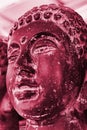 Viva Magenta monochrome color palette. Closeup statue Buddha head. Modern Art concept, soft focus.