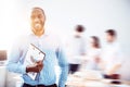Vivacious bearded guy with folder on blurred double exposed background Royalty Free Stock Photo