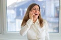 Vivacious businesswoman enjoying a good laugh over a mobile phone