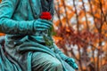 Vivant Denon, monument with a rose flower in the famous cemetery Paris Pere Lachaise, France. Golden autumn over eldest