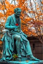 Vivant Denon, monument with a rose flower in the famous cemetery Paris Pere Lachaise, France. Golden autumn over eldest