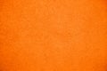 Vivid bright orange color coarse facade wall as an empty rustic texture background