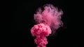 Vivid bright pink color smoke cloud exploding upwards dramatically against a solid deep black background creating an abstract Royalty Free Stock Photo