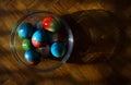 Vivid colored eggs in glass ball