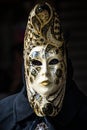 Vivid colorful black mask in the Venice carnival