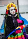 Vivid colorful costume inspired by Frida Kahlo in the Venice carnival