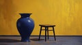 Vivid Contrasts: Lush Lemon Tree in a Sunny Yellow Pot with a Blue Stool Against a Dark Wall. Royalty Free Stock Photo