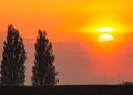 Vivid countryside sunset scene with a glowing sky Royalty Free Stock Photo