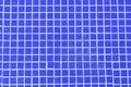 Vivid dark blue background texture of tile mosaic swimming pool Royalty Free Stock Photo