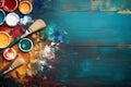 A vivid display of spilled artist palette oil paints and brushes arranged on blue wooden boards Royalty Free Stock Photo