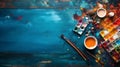 A vivid display of spilled artist palette oil paints and brushes arranged on blue wooden boards Royalty Free Stock Photo