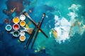 A vivid display of spilled artist palette oil paints and brushes arranged on blue wooden boards Royalty Free Stock Photo