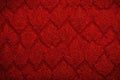 A vivid and festive red Christmas brocade fabric pattern background, featuring intricate and textured designs. The rich red hue Royalty Free Stock Photo