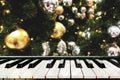 Vivid golden Christmas blur background with piano keys. Royalty Free Stock Photo