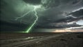 Vivid green lightning illuminating a dramatic thunderstorm over the desert at sunset Royalty Free Stock Photo