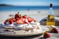 A vivid image of a berry-topped Pavlova against a sunny Australian Christmas beach scene. Royalty Free Stock Photo