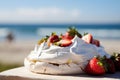 A vivid image of a berry-topped Pavlova against a sunny Australian Christmas beach scene. Royalty Free Stock Photo