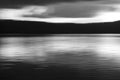Vivid lights of the lake sunset with long exposure effect. Balck and white