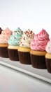 Vivid lineup cupcakes stand out individually against a clean white isolation
