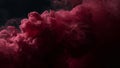 Vivid magenta ink diffusing dramatically into dark water creating a vibrant abstract cloud of color with fine particles suspended Royalty Free Stock Photo