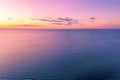 Vivid magenta orange sunset over water. Royalty Free Stock Photo