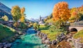 Vivid morning scene of Parish Church of St. Sebastian. Colorful autumn view of Bavarian Alps, Au village location. Bright outdoor