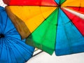 Vivid multi colored on the old and dirty beach umbrella Royalty Free Stock Photo