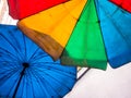 Vivid multi colored on the old and dirty beach umbrella