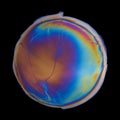 Vivid multicolored circle created by iridescent oil spill film isolated