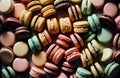 Vivid overhead shot capturing a delightful array of assorted macarons, arranged in a tempting display of confectionery artistry.