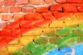 Vivid rainbow colored old bricks wall