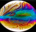 Vivid rainbow colours of a Macro soap bubbles creating psychedelic patterns