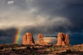 Vivid rainbow over Balanced Rock in Arches National Park