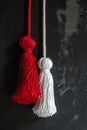 Vivid red and pure white Martisor tassels against dark textured grunge background. Moldavian, Romanian tradition 1 March Royalty Free Stock Photo