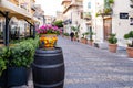 Vivid street in Cefalu old town, medieval village on Sicily island, Italy. Tourist attraction with cafes, historic