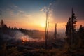 a vivid sunset over a clear-cut forest with smoke rising from burning debris