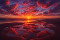 Vivid sunset sky with red clouds reflected in shallow pools on a beach sand ocean Royalty Free Stock Photo