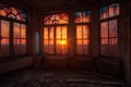 vividly colored sunset shining through broken windows of abandoned house, creating magical and surreal atmosphere Royalty Free Stock Photo