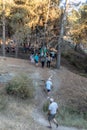 Viznar, Granada, Spain, August 18, 2022: Group of people walking along a path in the Viznar ravine on the occasion of the popular Royalty Free Stock Photo