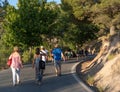 Viznar, Granada, Spain, August 18, 2022: Group of people walking along the road from Viznar to Alfacar on the occasion of the Royalty Free Stock Photo
