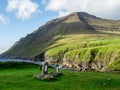 ViÃÂ°oy, ViÃÂ°areiÃÂ°i, old cemetery next to the church. View over the sea and mountains.s