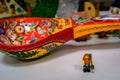 Vladimir, Russia - March 29, 2019: Funny bearded hipster lego-man minifigure with small souvenir spoon in Spoon Museum
