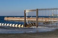 Seascape with berth and icy fence Royalty Free Stock Photo