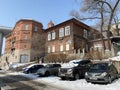 Vladivostok, Russia, February, 29,2020 Cars are parked on Pushkinskaya street in front of 15/1 in winter. Vladivostok, Russia