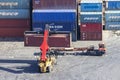 Reach stacker - a container handling loader at the port, loads a container onto a truck