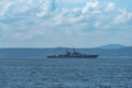 Seascape with a convoy of military vehicles on the roads.