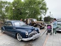 Vladivostok, Russia, May, 18, 2019. People walkingg on Exhibition of American retro-cars near Buick Road Master 1950 year of manuf