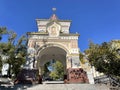 Vladivostok, Russia, October, 12, 2022. People walking in front of the triumphal Nicholas arch of the crown Prince in sunny wint